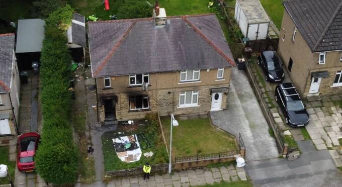 An aerial view of the fire-damaged house