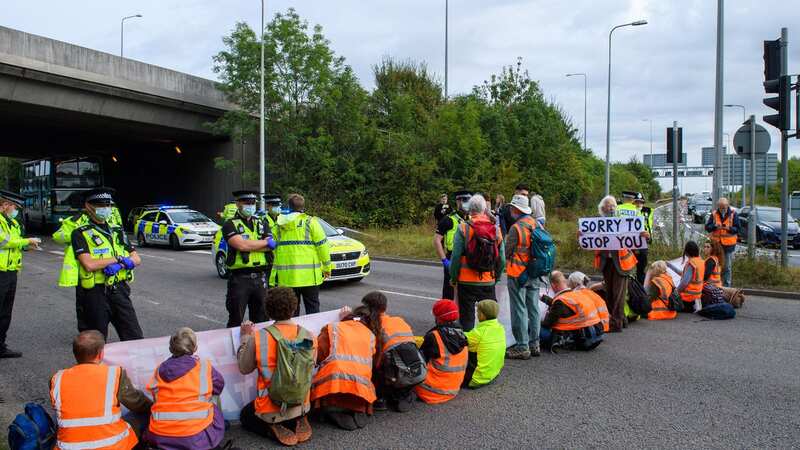 Protesters from Insulate Britain, an offshoot of XR, block a roundabout on the M25 (Image: Peter Manning/LNP)
