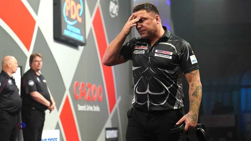 Gerwyn Price shocked fans by wearing ear defenders in his World Championship quarter-final defeat (Image: PA)