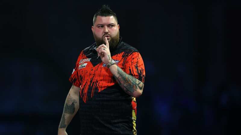 Michael Smith banned his kids from attending his semi-final clash (Image: Luke Walker/Getty Images)