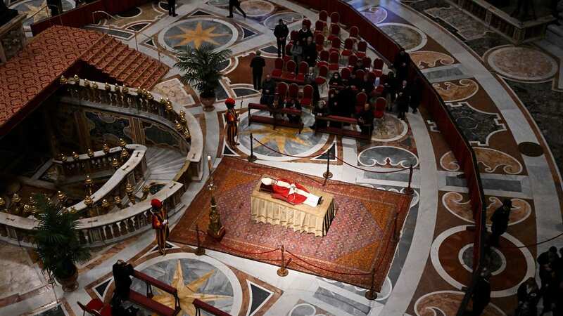 The body of Pope Emeritus Benedict XVI lays in state at St. Peter