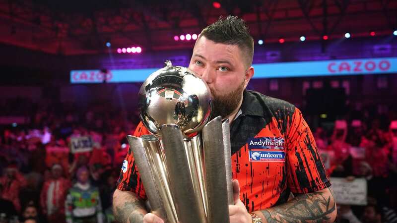 Michael Smith celebrates winning the PDC World Darts Championship after an epic final against Michael Van Gerwen (Image: PA)