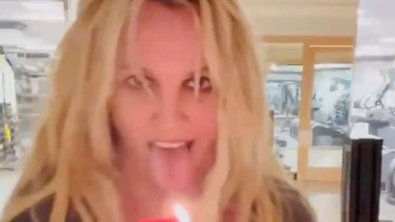 Britney Spears holds lighter to her face as she dances to JLo in bizarre video