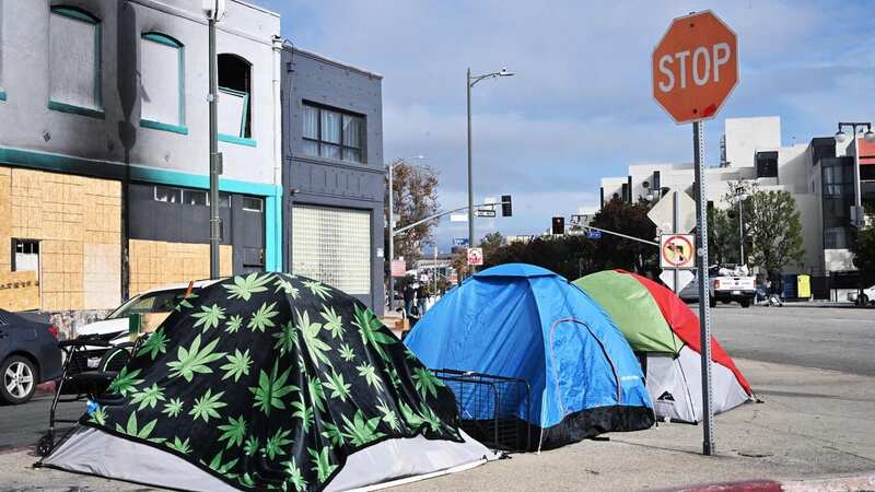 Homeless people sleeping under highways and in park benches could face fines (Image: AFP via Getty Images)