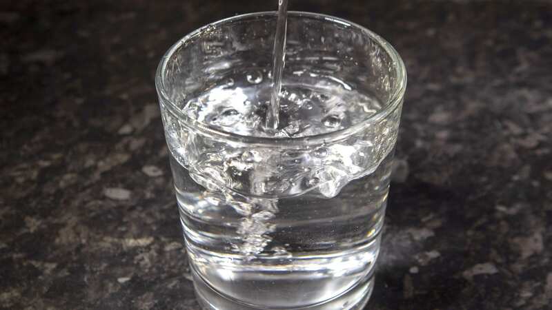 Brits typically drink just 740ml of the recommended two litres of water daily (Image: SWNS)