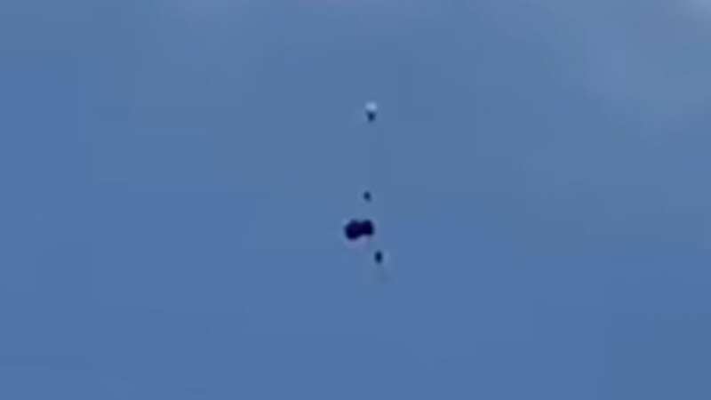 Moment skydivers plunge to the ground after their parachute fails to open