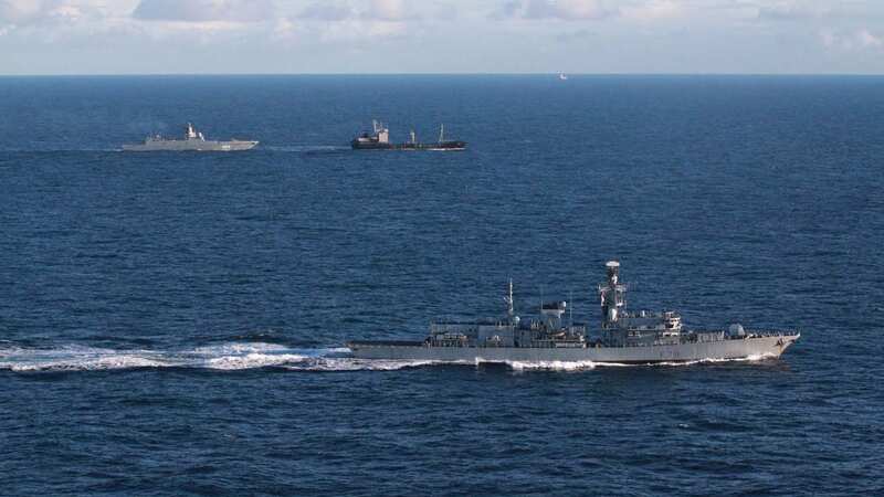 HMS Portland tracks Russian warship Admiral Gorshkov and a tanker in the background