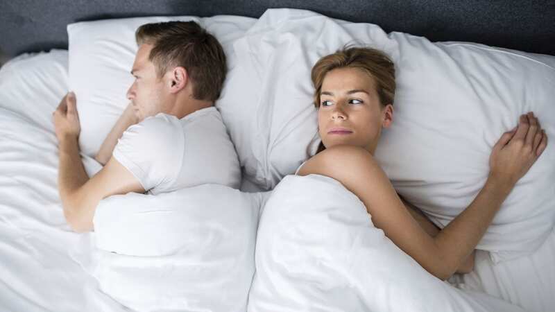 A couple stay in bed while listening to their neighbours having sex (Stock photo) (Image: Getty Images)