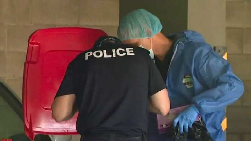 The remains of a woman were found partially buried in the garage of an apartment block in Alderley, Brisbane (Image: Nine)