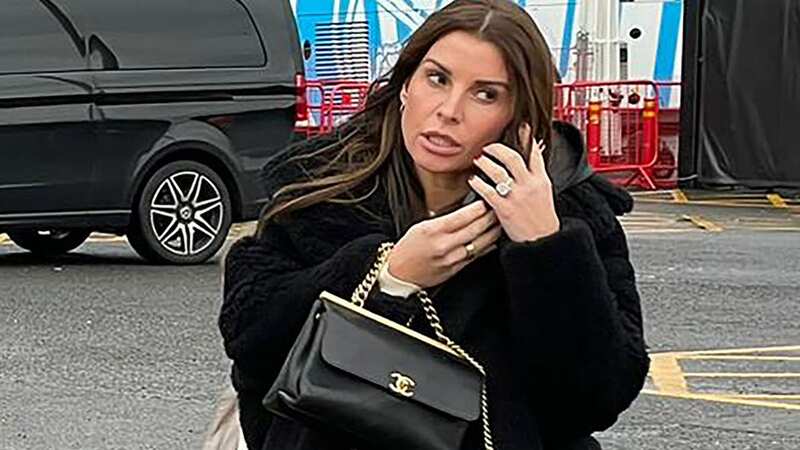 Coleen Rooney turns heads in chic outfit and £7,000 bag at Old Trafford