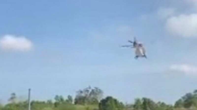 Helicopter crushes 8 people while trying to scatter sweets over children