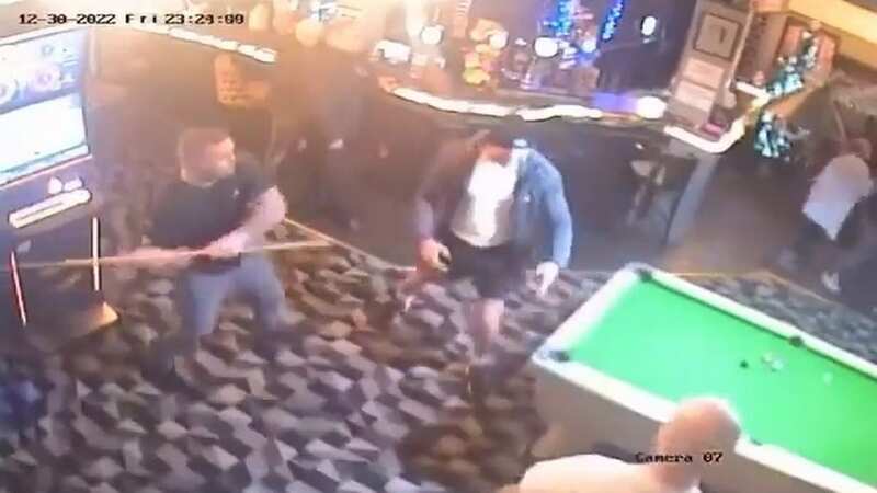 Bloke floors brawling punter in pub with pool cue in 