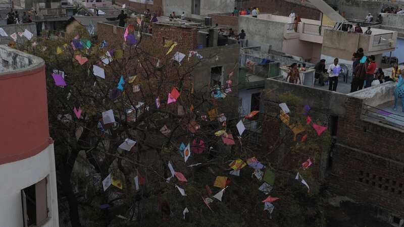 People celebrating the Uttarayan festival in India back in 2014, where hundreds turn out every year to fly kites (Image: AFP via Getty Images)