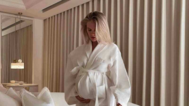 Molly-Mae Hague cradles her bump as she says pregnancy has been 
