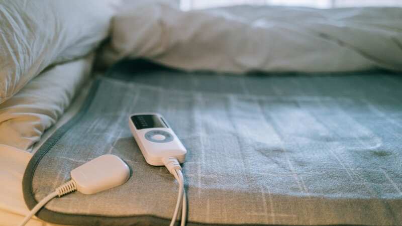 Most people use electric blankets under their sheets to heat their bed before they get in (Image: Getty Images/iStockphoto)