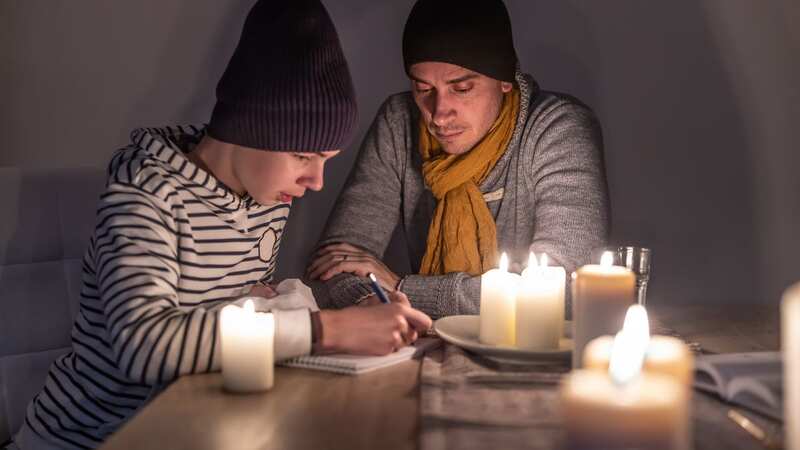 Would you be willing to sit in the dark to help the National Grid? (Image: Getty Images)