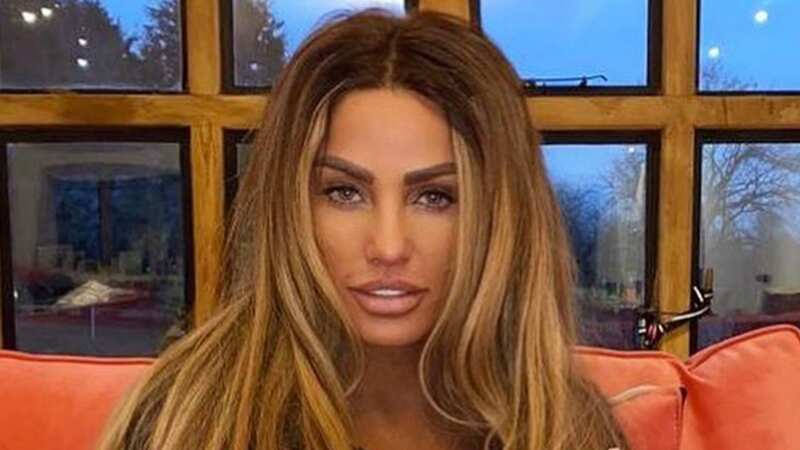Katie Price proudly poses with her old socks before sending worn items to fans