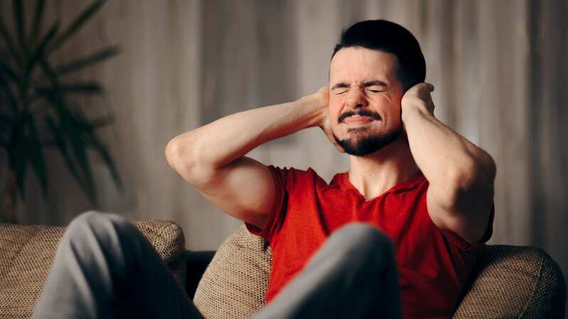 The man is being kept awake by the noisy vacuum (stock photo) (Image: Getty Images/iStockphoto)