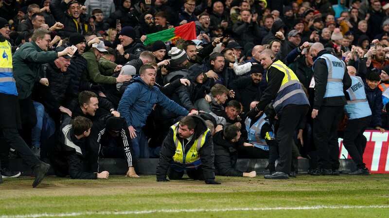 Man Utd fans fall onto pitch as hoardings collapse as they celebrate goal