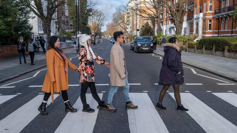 Tourists flock to Abbey Road in London to recreate The Beatles