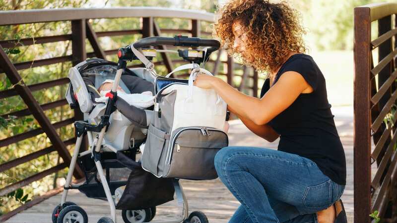 Organised parents now pack a minimum of 11 items in their baby bags before heading out (Image: Rich Legg/Getty Images)