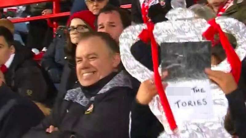 BBC accidentally show fan holding "F*** the Tories" poster during live coverage