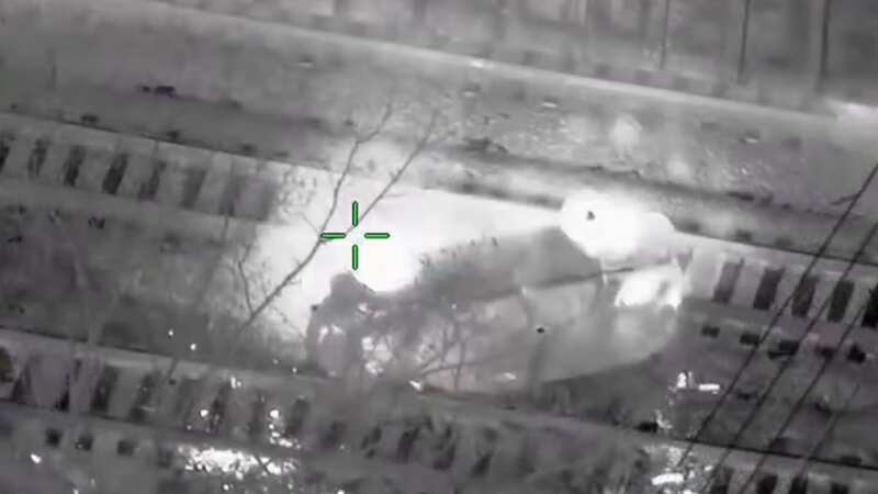 Suspect dragged from stolen police car seconds before it