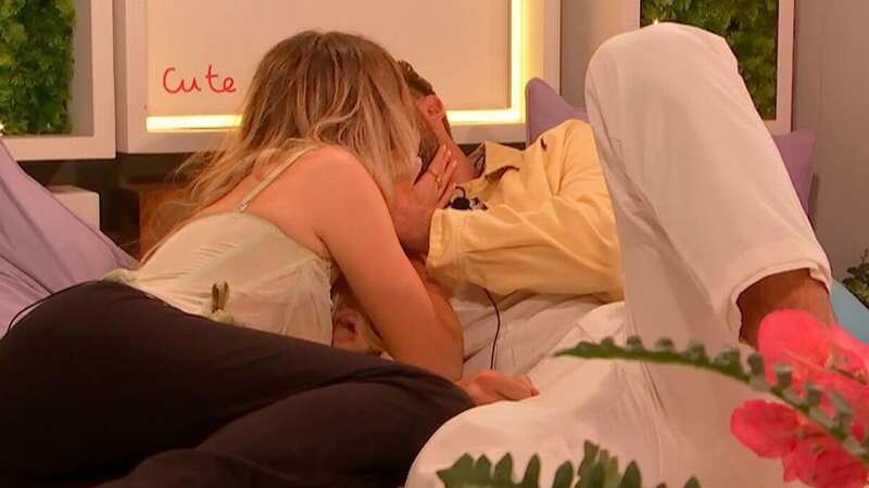 Love Island is set to be hit with a bombshell tonight as secrets are spilled in the villa after Ellie Spence and Tom Clare snuck away to the terrace for a clandestine kiss. (Image: REX/Shutterstock)
