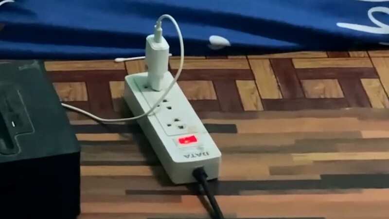 Puttawat Kamwan died with his arm touching a mobile phone charger (Image: ViralPress)