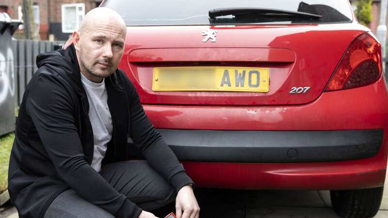 Steven Ward with his car the council sent him a clean air charge for a vehicle with a difference license plate (Image: Lee McLean/SWNS)