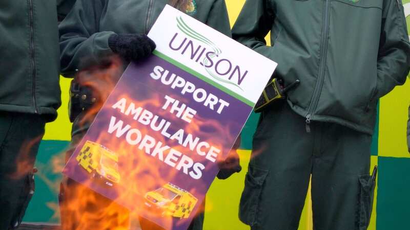 Ambulance workers stand on a picket line in London earlier this month. (Image: Kirsty Wigglesworth/AP/REX/Shutterstock)