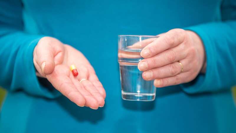 Nearly half of Brits believe taking extra vitamins will ward off the symptoms of a cold (Image: SWNS)
