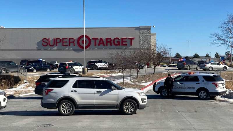 Police officers gather outside a Target store in Omaha (Image: Josh Funk/AP/REX/Shutterstock)