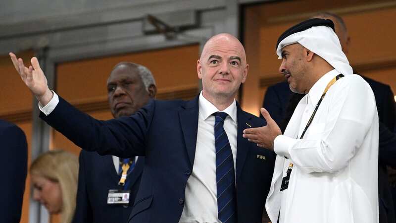 Gianni Infantino, President of FIFA, talks with a guest prior to a FIFA World Cup Qatar 2022 match (Image: Getty Images)