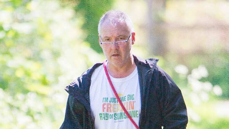 Disgraced cancer surgeon "The Butcher of Birmingham" Ian Patterson out walking his dog (Image: Daily Mirror)