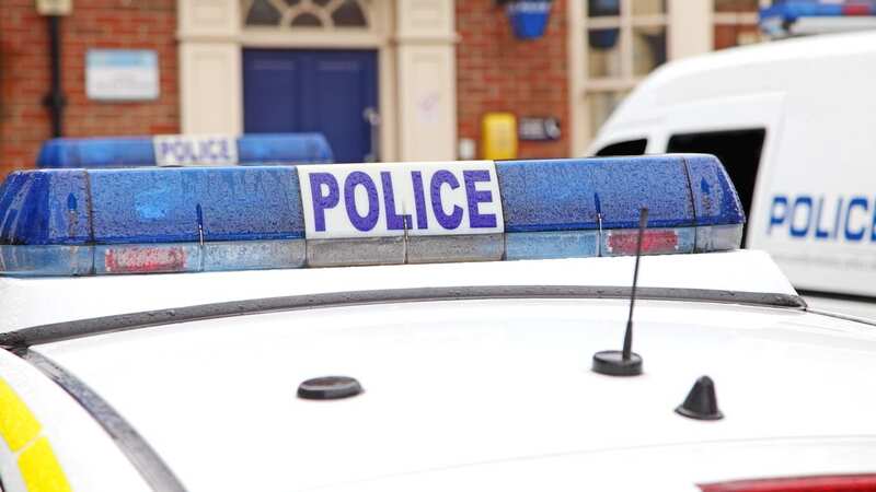 Close up of parked police vehicles outside a county police station. (Image: Getty Images)