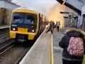 Train bursts into flames forcing passengers to run for their lives