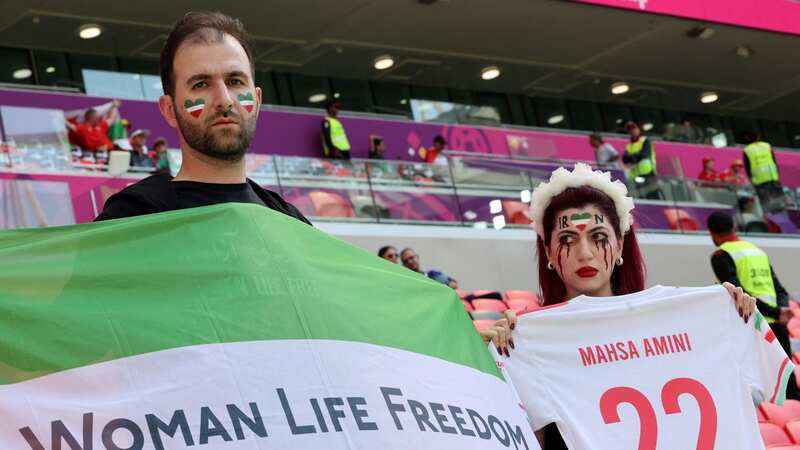 The Iran supporters make their feelings known before match against Wales. (Image: AFP/Getty Images)