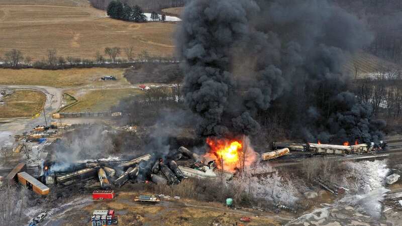 The wreckage continues to burn (Image: Gene J Puskar/AP/REX/Shutterstock)