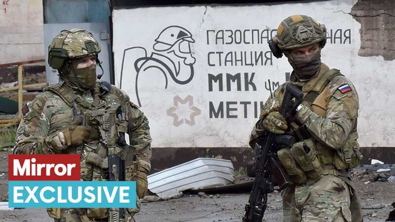 Russian servicemen stand guard at the Ilyich Iron and Steel Works in Mariupol (Image: AFP via Getty Images)