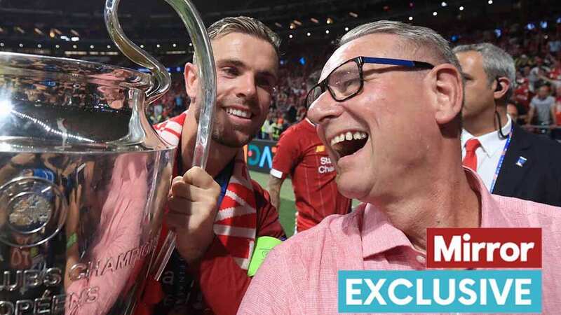 Jordan Henderson of Liverpool poses with his father Brian and the trophy during the UEFA Champions League Final in 2019 (Image: Getty Images)