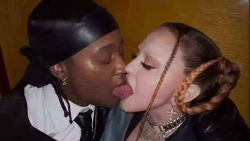 Madonna enjoys X-rated tongue kiss with musician after slamming 