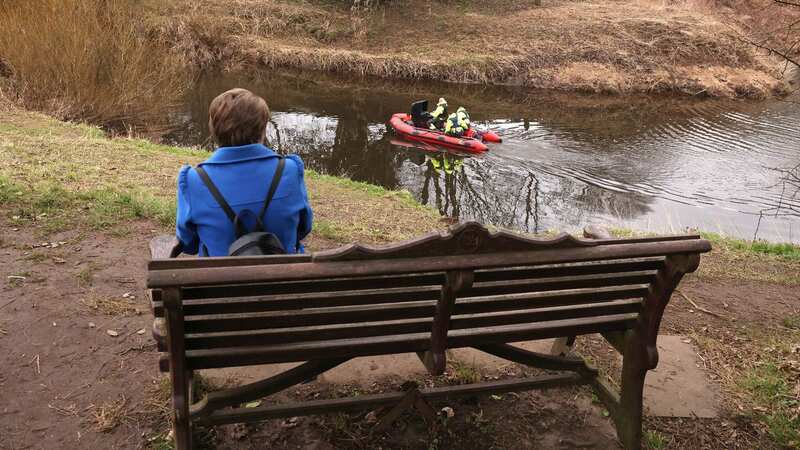 A woman sits on the bench where Nicola Bulley