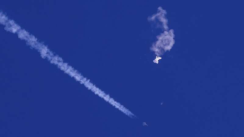 The remnants of a surveillance balloon drift above the Atlantic Ocean (Image: Chad Fish/AP/REX/Shutterstock)
