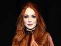 Lindsay Lohan glows in ultra rare public appearance with family at Fashion Week eidqiqzzideeinv