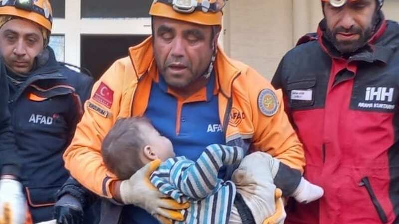 2-year-old Mert Tatar is rescued under rubble (Image: Anadolu Agency via Getty Images)