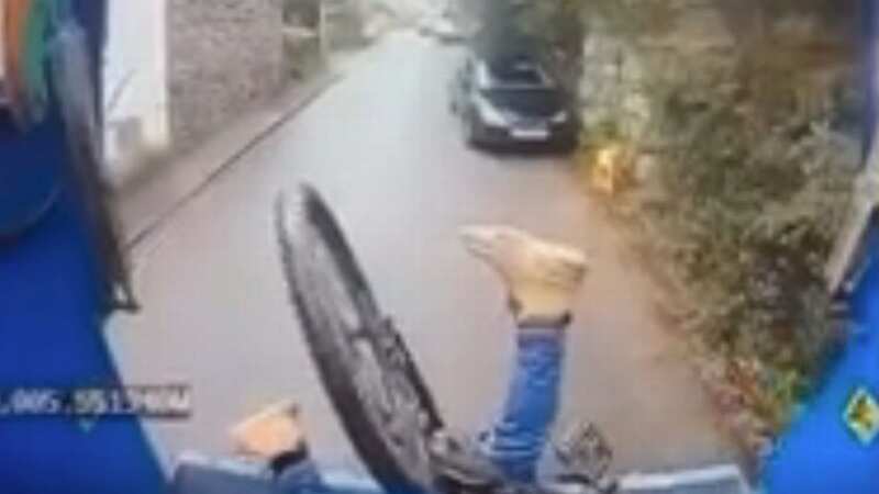 Cyclist lands head first inside back of bin lorry - and it