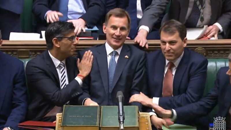 Jeremy Hunt is reportedly looking into ways of driving down the number of people signed off sick (Image: GETTY)