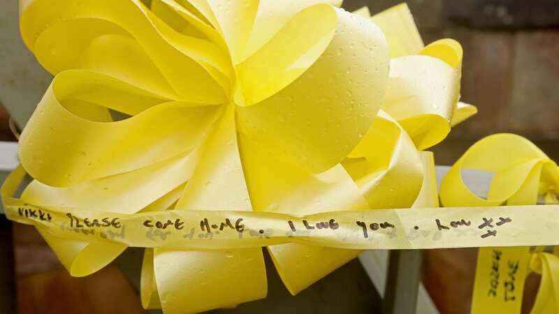 Messages have been penned on yellow ribbons of hope (Image: Julian Hamilton/Daily Mirror)