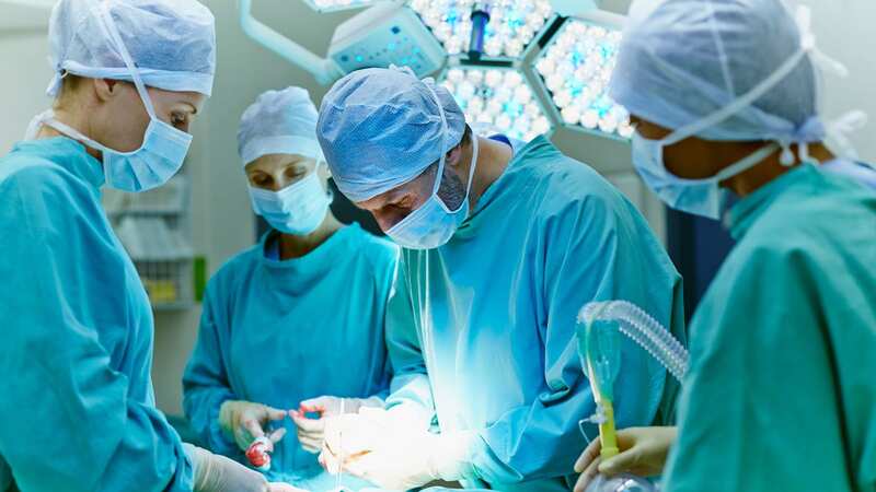 Surgeons perform a procedure (stock image) (Image: Getty Images)